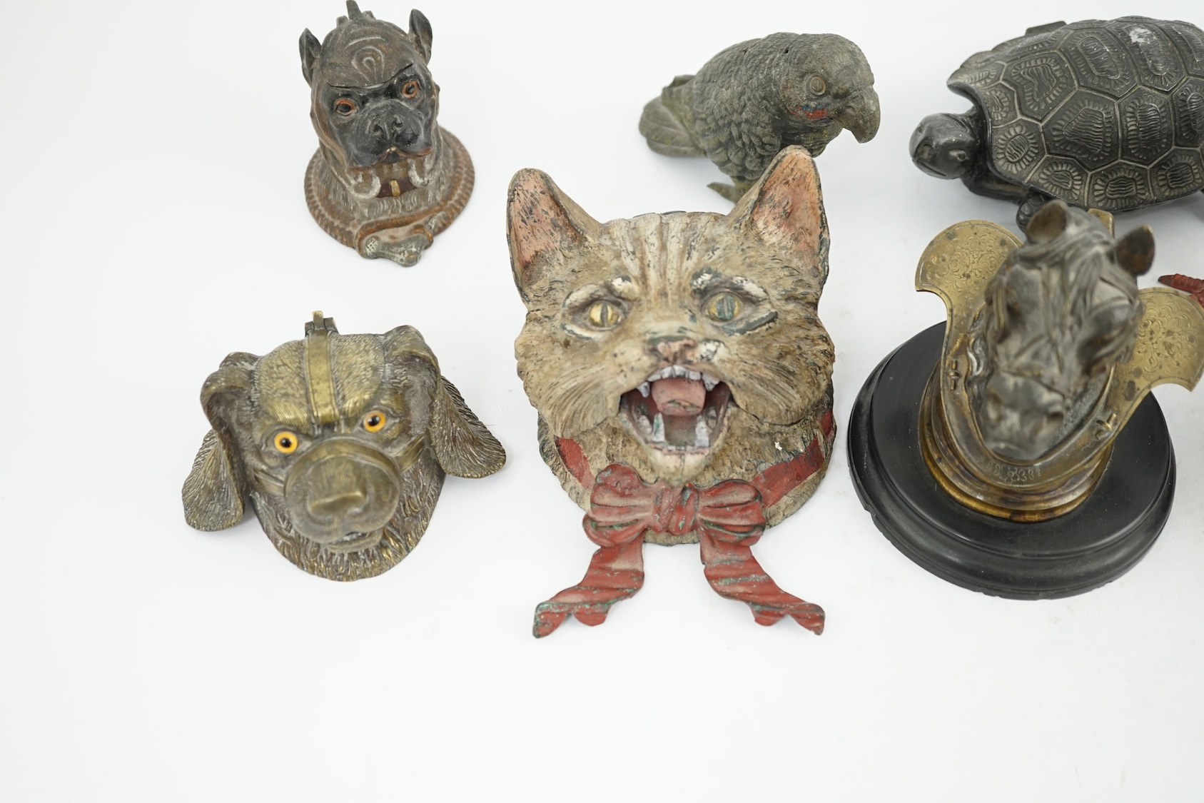 A collection of nine 19th and 20th century novelty animal bronze and metal ink wells, including a Martin Brothers-style ‘Wally’ inkwell. Condition - minor chips due to use and age